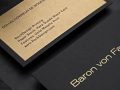 black business card with metallic gold ink