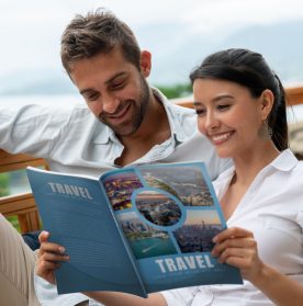 Couple looking at print marketing travel guide