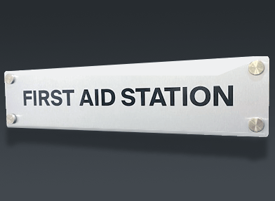 metal sign for first aid station